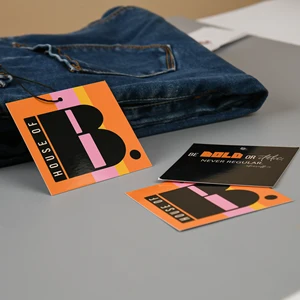 Custom Hang Tags: Retail Display & Paperstock Guide 3 Custom Hang Tags shown as a UK textile label manufacturing example with hang tag size label and patch label application