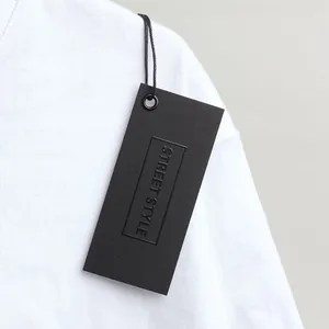 Custom Hang Tags: Retail Display & Paperstock Guide 2 Custom Hang Tags shown as a UK textile label manufacturing example with printed fabric label and care label
